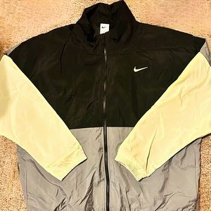 Men’s Nike Windbreaker Size XXL Black & Gray with light neon sleeves.
